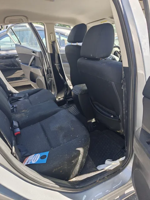 Mazda rear cabin with visible marks on dark cloth seats